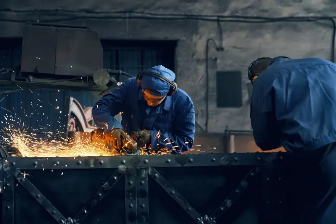 Two Workers Making Gates Metalco Bahrain